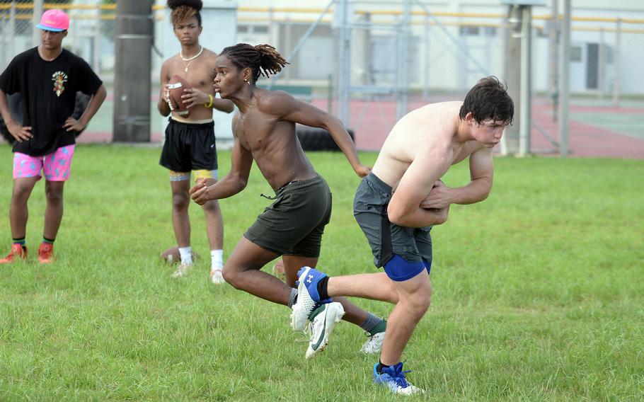 Senior Carlos Cadet, left, is tabbed as Kubasaki's starting quarterback; fellow senior Lukas Gaines should see time at fullback and linebacker.