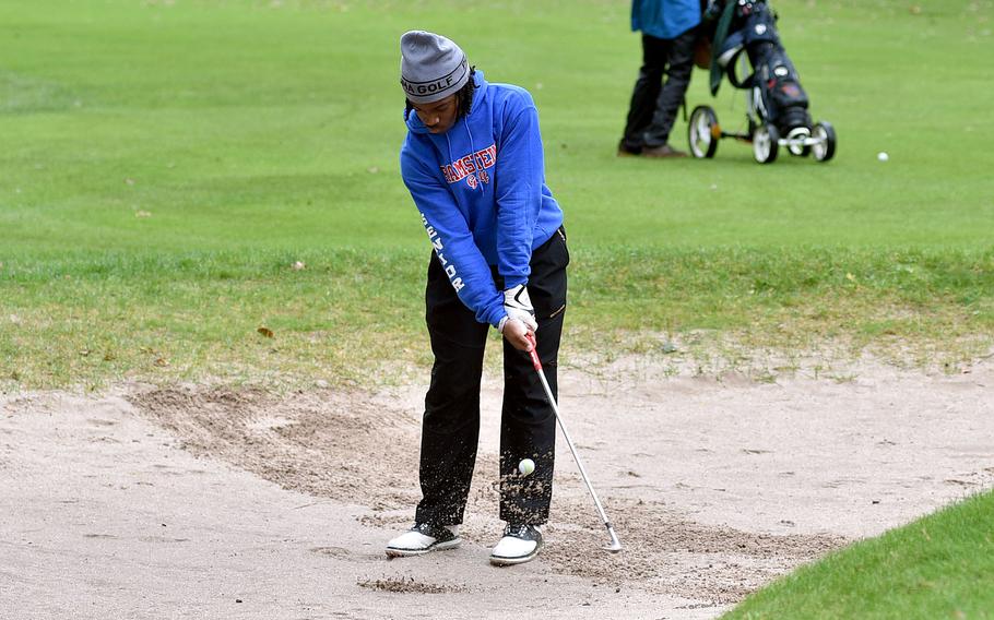 Daivd Obermuller chips out of the bunker.