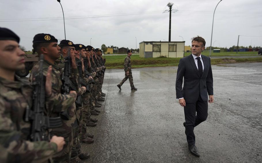 French President Emmanuel Macron reviews French troops in eastern France, Oct. 9, 2024.