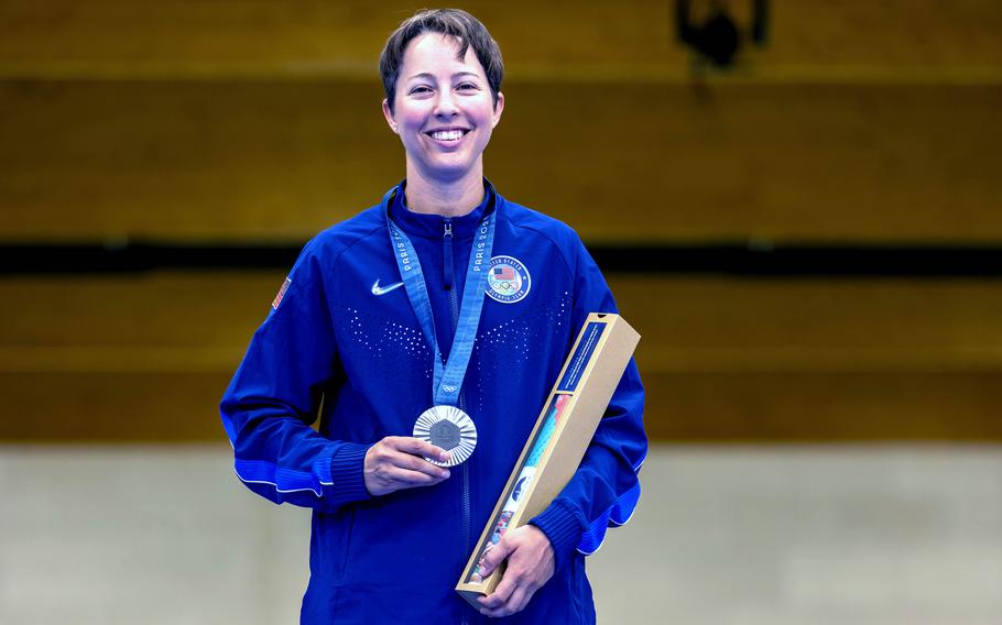 Sagen Maddalena, a sergeant with the U.S. Army Marksmanship Unit, shows off silver medal after finishing second in the women’s 50-meter rifle three-position competition at the 2024 Paris Olympics at the Chateauroux Shooting Centre, in Chateauroux, France on Friday, Aug. 2, 2024. 