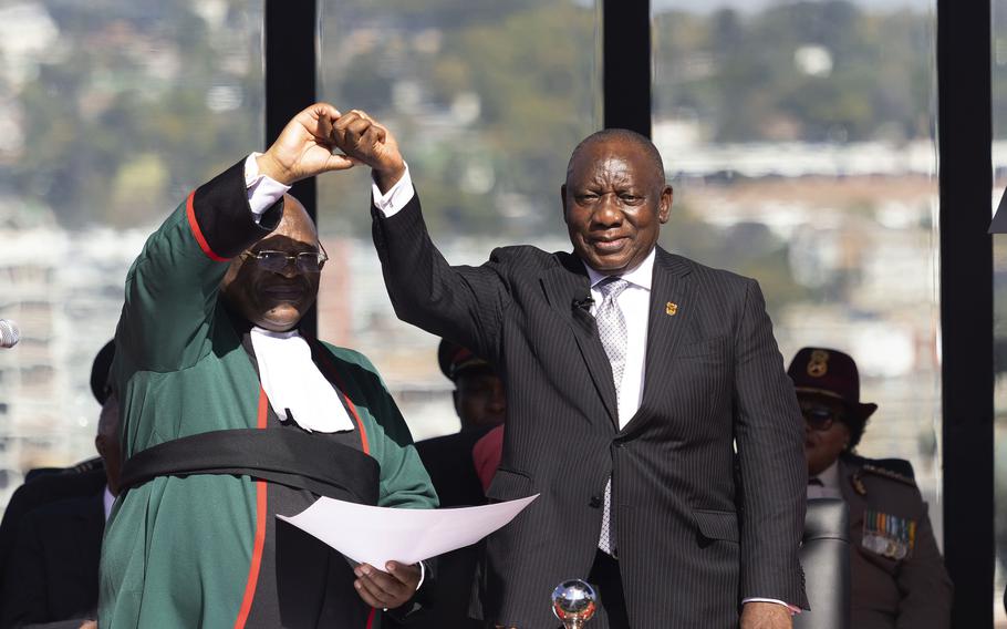 South Africa's Cyril Ramaphosa, is sworn in as President by Chief Justice Raymond Zondo, left, at his inauguration at the Union Buildings in Tshwane, South Africa, Wednesday, June 19, 2024. 
