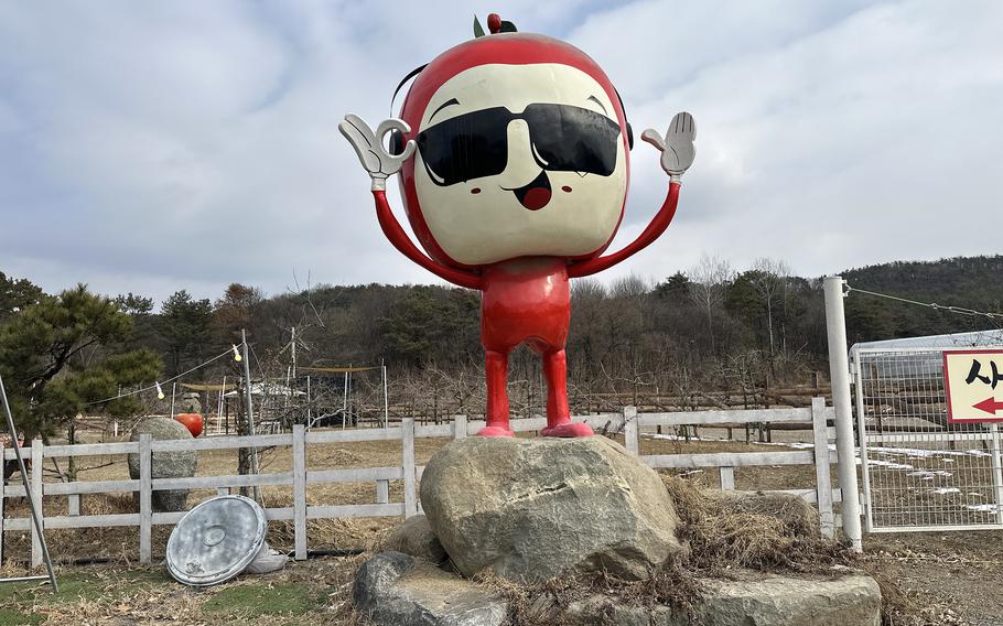 A cartoon apple welcomes visitors to Apple Changko Cafe in Pocheon, South Korea.