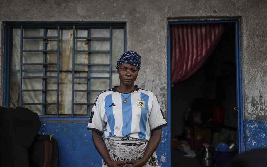 Louise Sabina, 39, poses for a photo at a school where she and her 10 children found shelter.