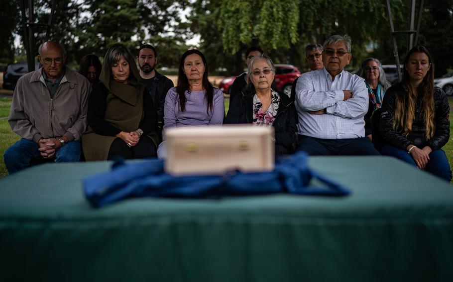 Family members of Mary Sara gather with local community members for the burial of her brain at Evergreen Washelli, a cemetery in Seattle, on Aug. 29, 2023.