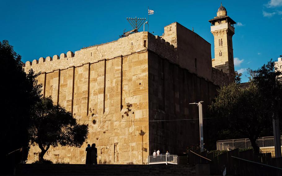 The sun sets on the Cave of the Patriarchs, a popular religious shrine for both Jewish and Muslim worshipers in the Old City of Hebron.