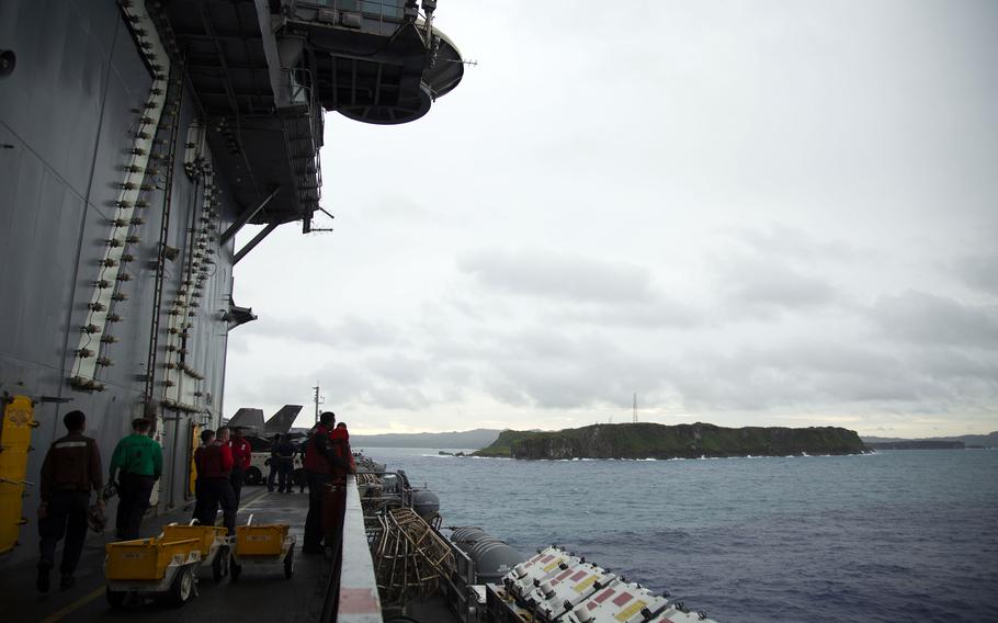 The aircraft carrier USS Abraham Lincoln pulls into Guam, Sunday, Aug. 4, 2024.