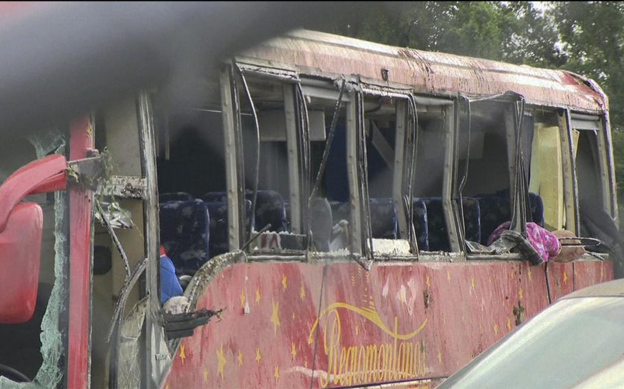 A damaged bus is shown