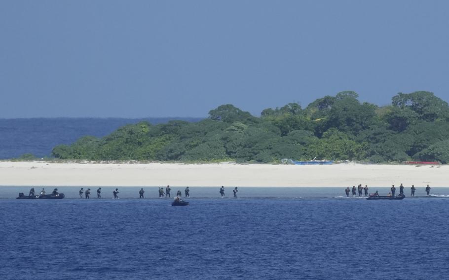 Philippine troopers arrive on Loaita island to seize it as part of a military drill, Nov. 6, 2024.