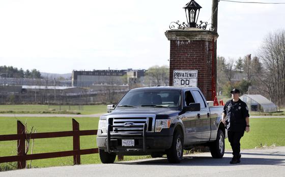 FILE - A police officer guards an entrance to the Souza-Baranowski Correctional Center, Wednesday, April 19, 2017, in Shirley, Mass.  (AP Photo/Elise Amendola, File)