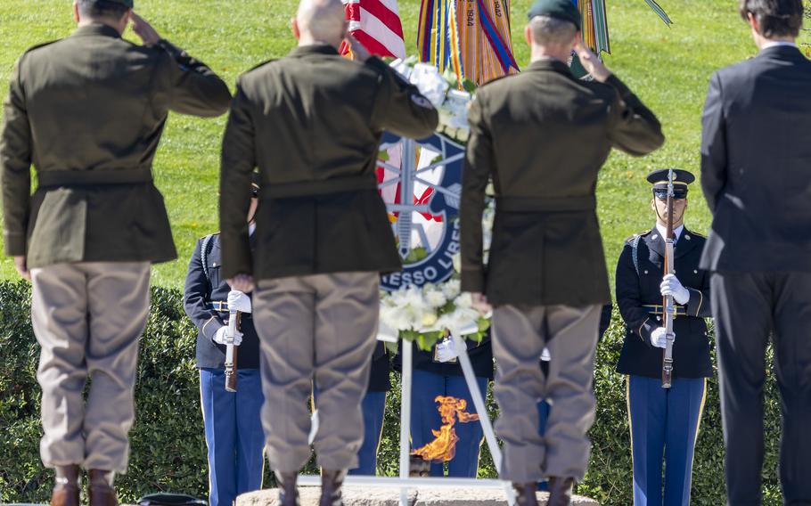 An honor guard stands at attention as the U.S. Army’s 1st Special Forces Command (Airborne) honors President John F. Kennedy at Arlington National Cemetery in Arlington, Va., on Oct. 17, 2024.