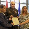 Major General Ray Shields, the adjutant general of New York, presents the New York State Conspicuous Service Cross, to the niece and grand-niece of Pvt. John Greschiak, a World War II Soldier who was killed in action on Sept. 16, 1944, during a ceremony at which he was posthumously at New York National Guard headquarters in Latham, New York on Sept. 16, 2024. They, at left, Donna Cramer of Albany, and Cheri Gagliardi, a Rotterdam resident. (U.S. Army National Guard Photo by Stephanie Butler)