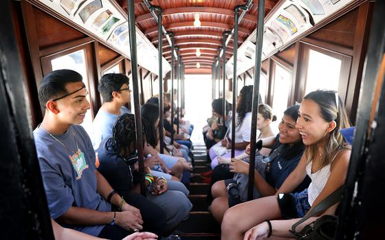 Students in the American Exchange Project, a domestic exchange program for graduating high school seniors, ride Angels Flight Railway during a tour of downtown Los Angeles on July 19.  The program is designed to break down entrenched stereotypes and spark lasting friendships.