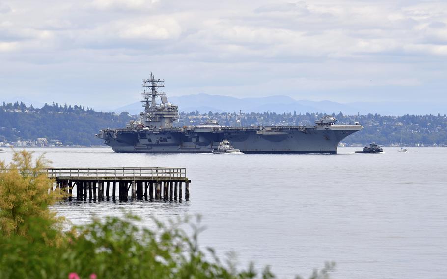 The aircraft carrier USS Ronald Reagan steams through Puget Sound toward its new homeport, Naval Base Kitsap, in Bremerton, Wash., Aug. 13, 2024.