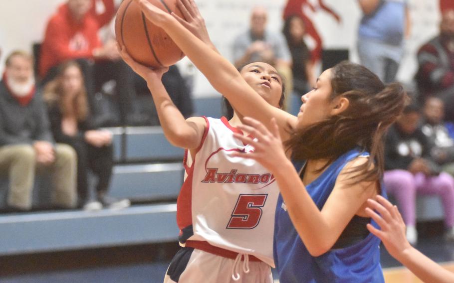 Aviano sophomore point guard Ily Zamora gets fouled by Marymount’s Sofia Miller in the Saints’ 48-26 victory over the Royals on Friday, Dec. 1, 2023. Zamora set a school record for free throw attempts in a single game, converting 19 of 32.