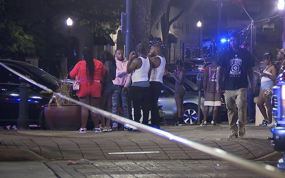 This image provided by WBMA shows bystanders near the scene of a shooting in Birmingham, Ala., Sunday, Sept. 22, 2024.