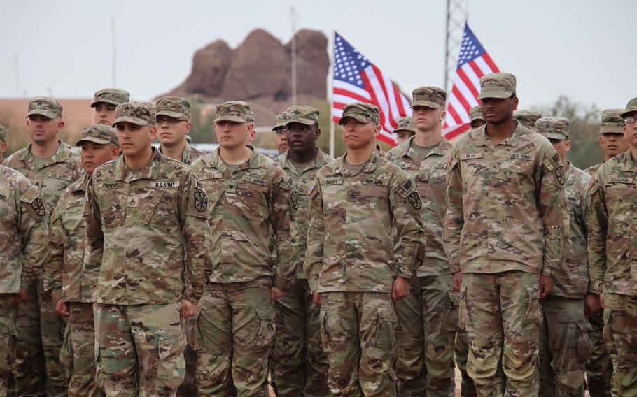 More than 150 service members of the 856th Military Police Company from the Arizona Army National Guard rally together with their families on Bushmaster Field in Phoenix, Ariz., for an send-off ceremony Sunday, Jan. 21, 2024. 