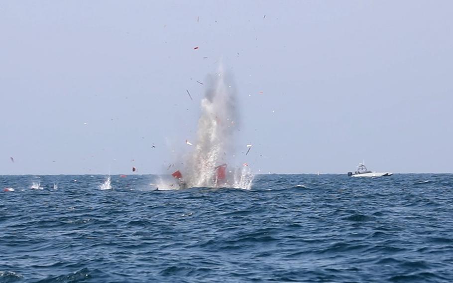 Munitions launched from T-38 Devil Ray unmanned surface vessel destroy a training target during exercise Digital Talon 2 in the Persian Gulf, Nov. 27, 2023.