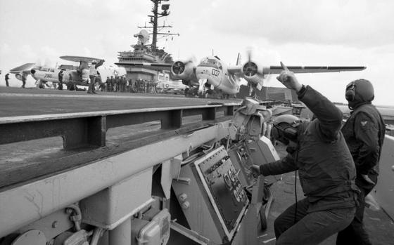 Somewhere in the Mediterranean Sea, Apr. 16, 1970: The catapult deckedge operator signals as a C-1 Trader is readied for a catapult launch aboard the USS Forrestal. The ship is conducting operations in the Mediterranean Sea. 

Looking for Stars and Stripes’ historic coverage? Subscribe to Stars and Stripes’ historic newspaper archive! We have digitized our 1948-1999 European and Pacific editions, as well as several of our WWII editions and made them available online through https://starsandstripes.newspaperarchive.com/

META TAGS: U.S. Navy; USS Forrestal; 6th Fleet; aircraft carrier; attack aircraft carrier; launch; catapult; flight deck