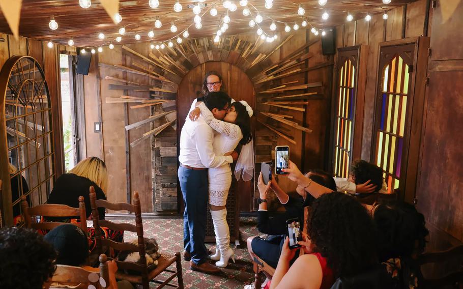 William Ascencio and Jen Ballera, who live two doors down from the event space, are married by officiant and co-owner Dan Gambelin. Gambelin and Tess Sweet, who own Old Brown House, were ordained online through the Universal Life Church to perform weddings.