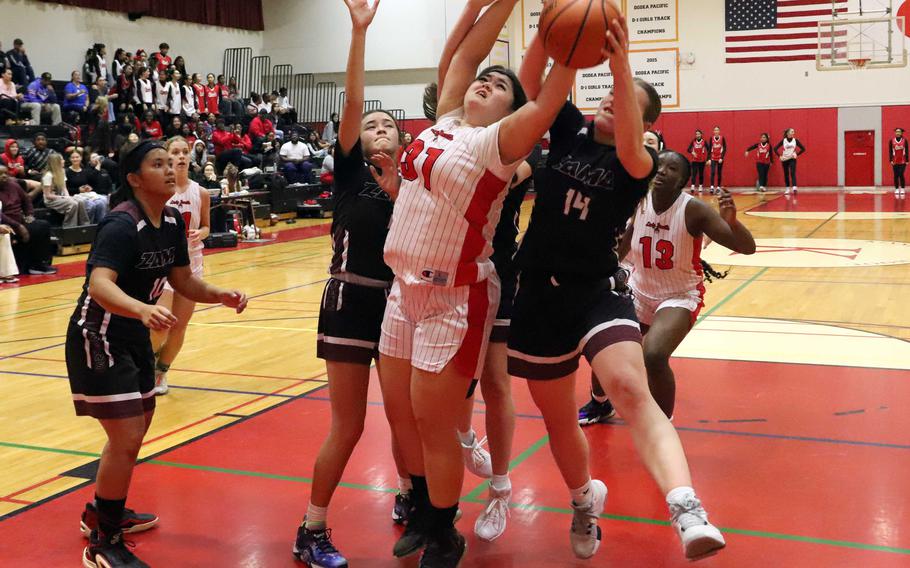 Bella Hunter grabs a rebound.