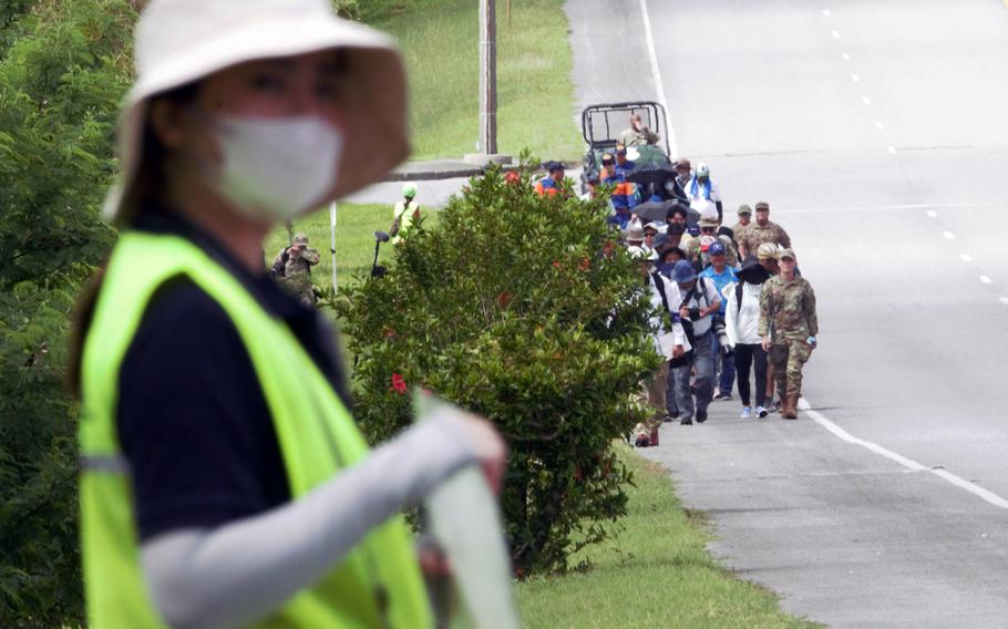 American and Okinawan volunteers practice evacuating from a tsunami during a drill at Kadena Air Base, Okinawa, Saturday, Sept. 16, 2023.