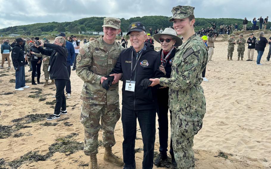 Fred Taylor, a 101-year-old who flew P-51s with the 52nd Fighter Squadron mostly in the Italian campaign, greets well-wishers at Omaha Beach on June 4, 2024. He was part of a group of nearly 70 World War II veterans flown to France for the 80th anniversary of the D-Day landings.