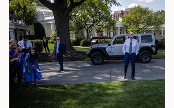 President Biden talks to reporters Aug. 5, 2021, after driving an electric vehicle around the White House grounds and delivering remarks on his administration’s plan to strengthen American leadership on clean cars and trucks.