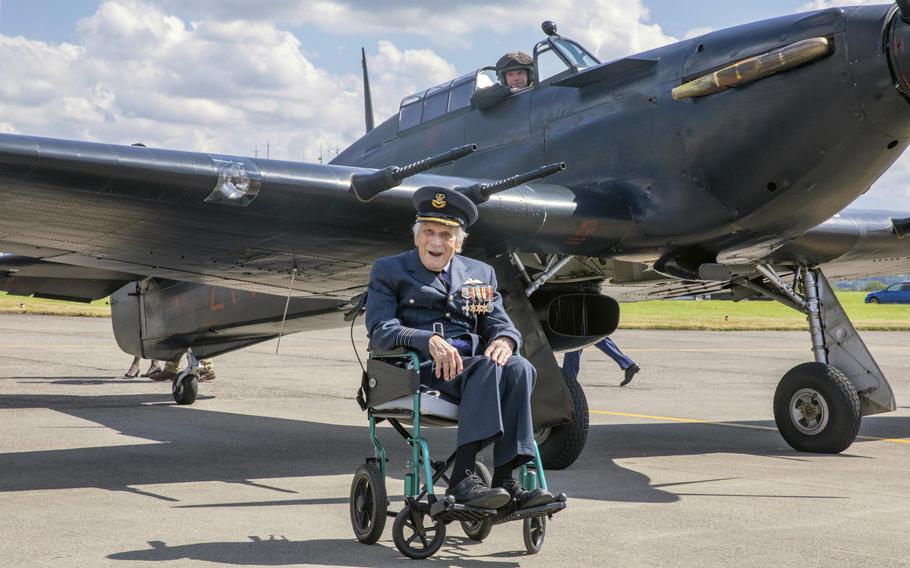 John “Paddy” Hemingway poses for a photo in front of an aircraft