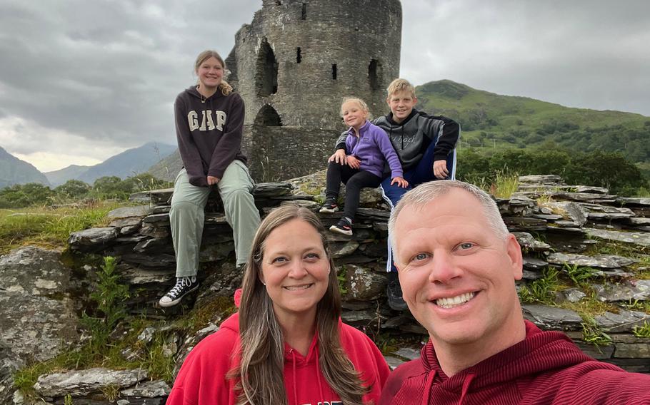 U.S. Air Force Col. Eric Muller, front right; wife Erinn, front left; and their children, back row from left, Taegan, Tristen and Tarynn pose in a recent photo in northern Wales. The Mullers will be watching men's and women's soccer in Marseille, France, and beach volleyball in Paris during the Summer Olympics.