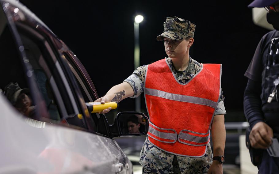 Marine Corps Cpl. Priya Hasham of the 31st Marine Expeditionary Unit conducts a breath test at Camp Hansen, Okinawa, July 19, 2024. 