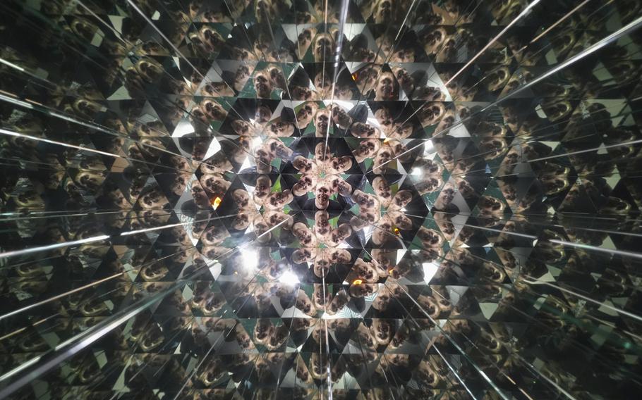 A kaleidoscopic image of a person’s face.