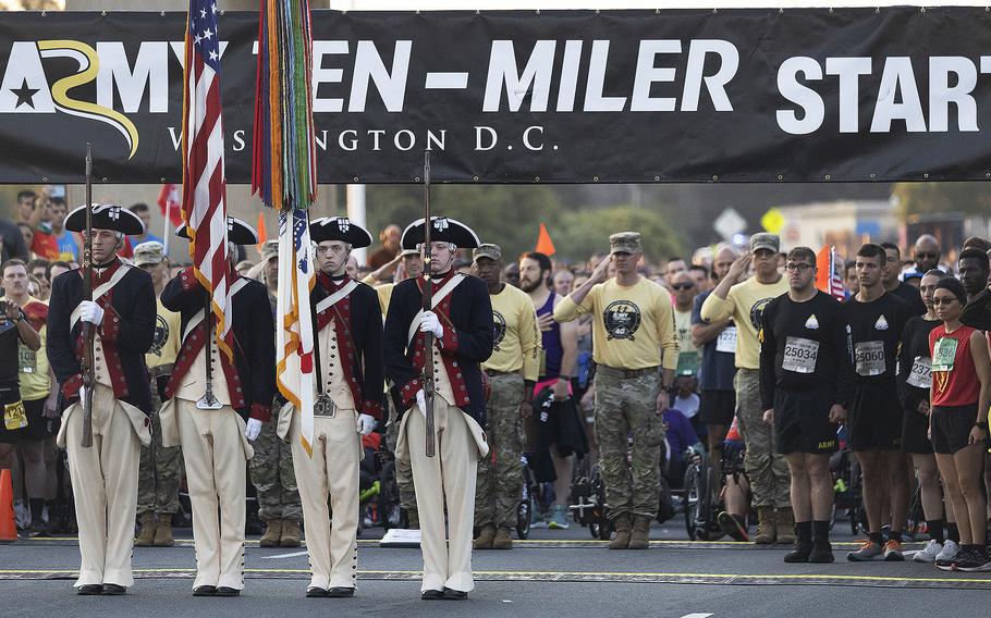 Runners stand still for colors presentation at the starting line