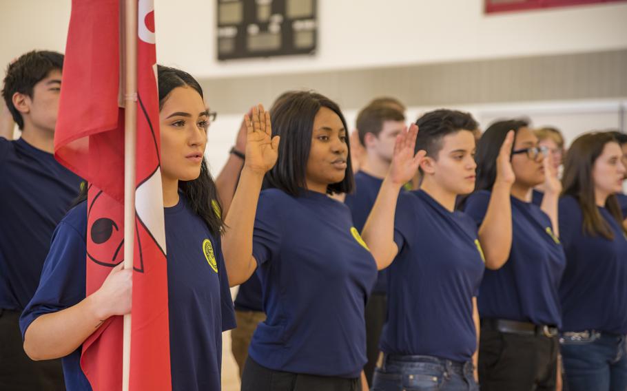 New Navy recruits take the oath of enlistment in Chicago in April 2019.