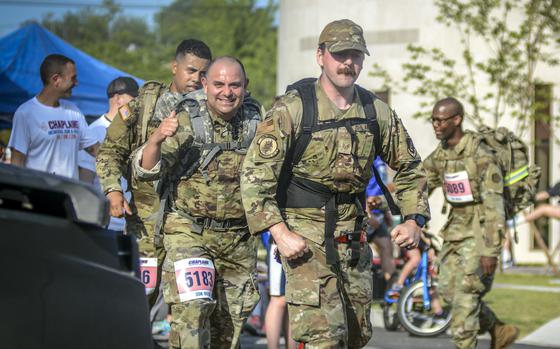 U.S. troops and others take on a nearly 19-mile Norwegian ruck march during the Four Chaplains event at Osan Air Base, South Korea, on May 18, 2024.