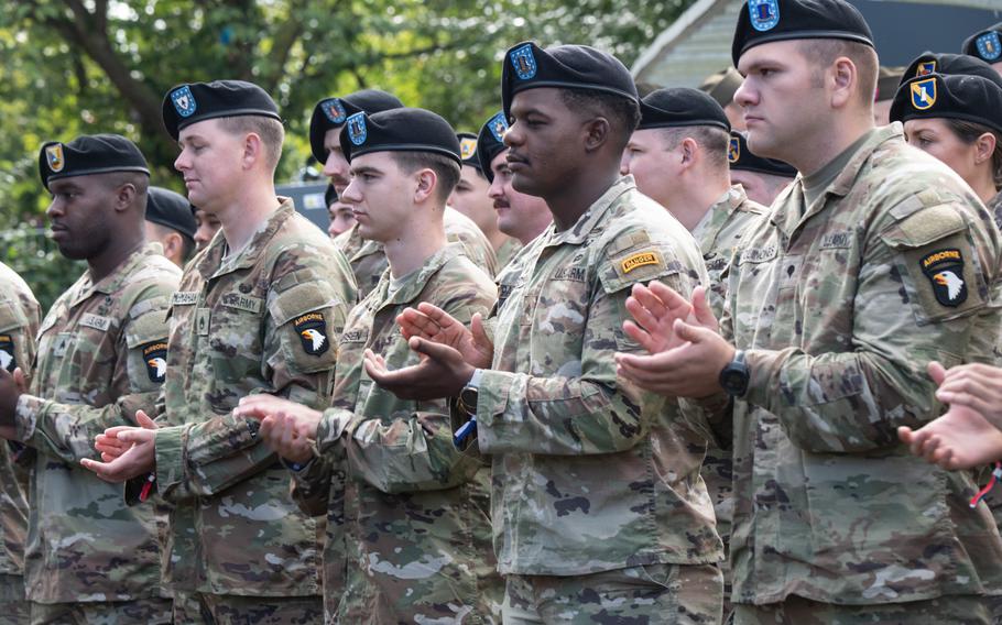 Soldiers with the 101st Airborne Division participate in a ceremony in Mesch