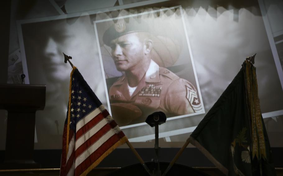 An image of retired Sgt. Maj. William “Billy” Waugh is displayed in a slide show during USSOCOM’s memorial ceremony for Waugh on June 27, 2023, at MacDill Air Force Base in Tampa, Fla. Waugh was 93.