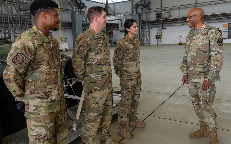 Air Force Chief of Staff Gen. Charles Q. Brown Jr., right, talks to 1st Lt. Miolani Grenier, Tech. Sgt. Eric Dafforn and Senior Airman Jordan Bybee during his visit to Ramstein Air Base, Germany, July 15, 2021. 