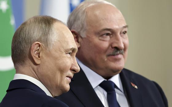 Russian President Vladimir Putin, left, and Belarus' President Alexander Lukashenko pose for a photo during the the Commonwealth of Independent States (CIS) meeting at the Igora resort in the Leningrad Region, about 54 km (33,75 miles north of St. Petersburg in Igora, Russia, Wednesday, Dec. 25, 2024. (Alexander Kazakov, Sputnik, Kremlin Pool Photo via AP)