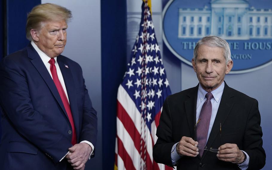 Dr. Anthony Fauci, right, then director of the National Institute of Allergy and Infectious Diseases, and then President Donald Trump participate in the daily coronavirus task force briefing at the White House on April 22, 2020, in Washington, D.C. 