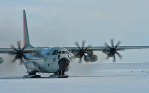 A ski-equipped LC-130 Hercules from 139th Expeditionary Airlift Squadron taxis at Williams Field, a compacted snow ice runway at McMurdo Station, Antarctica, on Jan. 31, 2023.