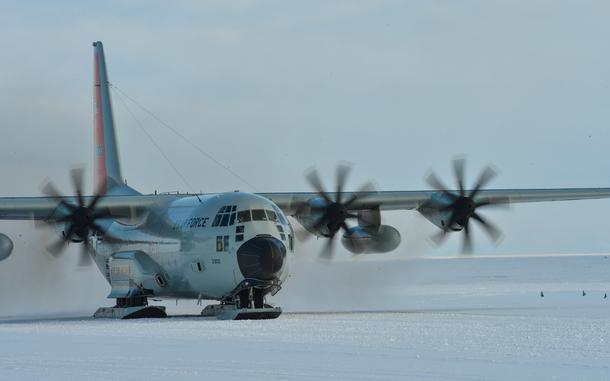 A ski-equipped LC-130 Hercules from 139th Expeditionary Airlift Squadron taxis at Williams Field, a compacted snow ice runway at McMurdo Station, Antarctica, on Jan. 31, 2023.