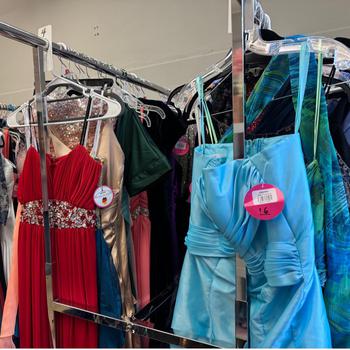 Many dresses hanging on three racks at Germany-Operation Deploy Your Dress