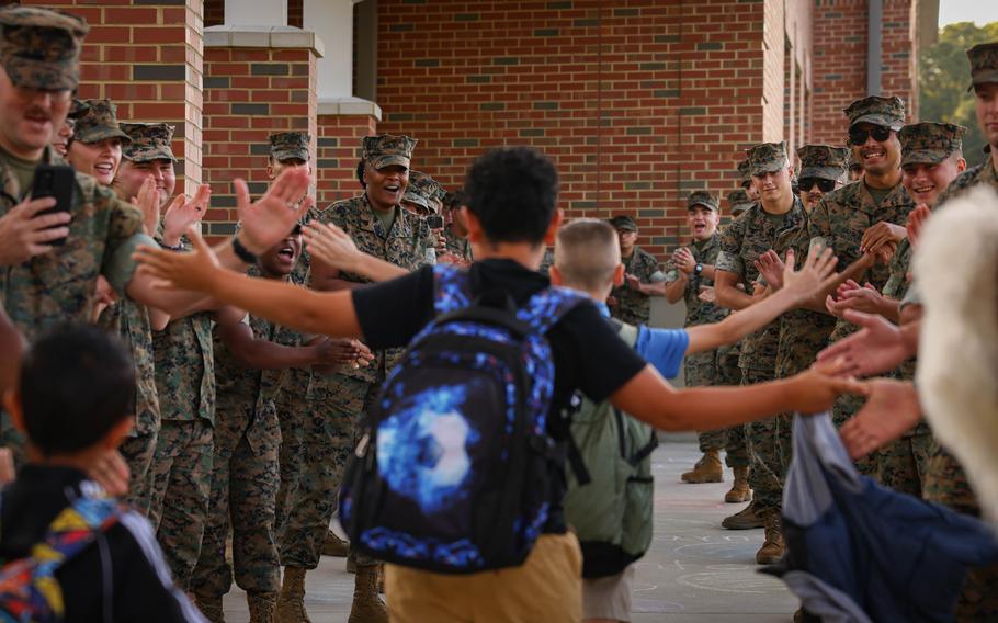 Students are greeted by U.S. Marines during a back-to-school celebration at the Crossroads Elementary School on Marine Corps Base Quantico, Va., Aug. 21, 2024. 