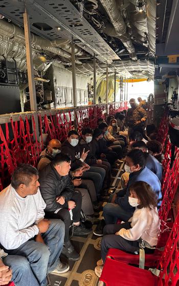 People sitting inside an aircraft.