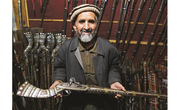 HED: Insurgent history, 2014

Kabul, Afghanistan, Feb. 5, 2014: Sher Mohammed holds a replica jezail musket in his shop in downtown Kabul. Jezails, which were originally handmade by Afghans during their fight against the British in the 19th century, have survived along with other antique guns as a popular souvenirs for American servicemembers.

Read about the history of the jezail and check out more photos here. 
https://www.stripes.com/theaters/middle_east/afghan-musket-survives-as-symbol-of-insurgent-history-1.290546

META TAGS: Afghan history; Operation Enduring Freedom