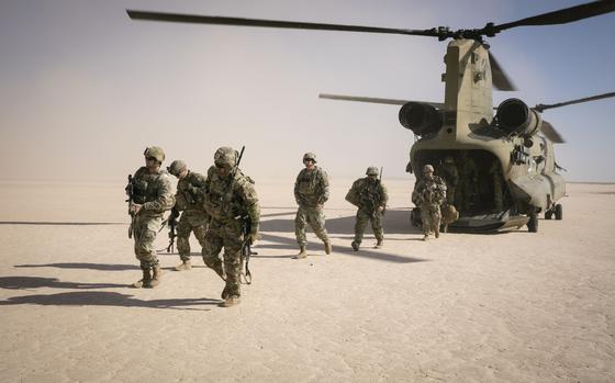 Georgia Army National Guard soldiers exit a CH-47 Chinook helicopter for a training mission in support of Operation Inherent Resolve near al-Tanf Garrison in Syria on Oct. 29, 2024. 