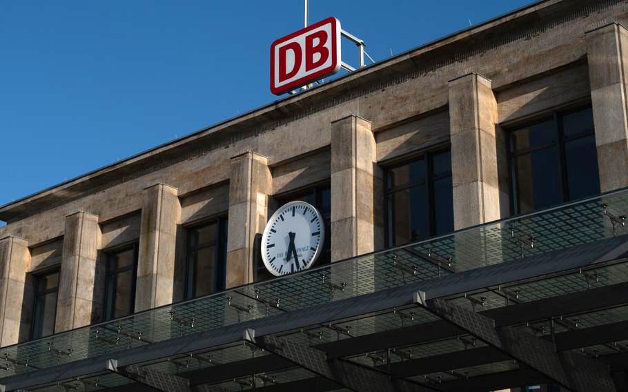 Kaiserslautern train station with clock and DB sign.