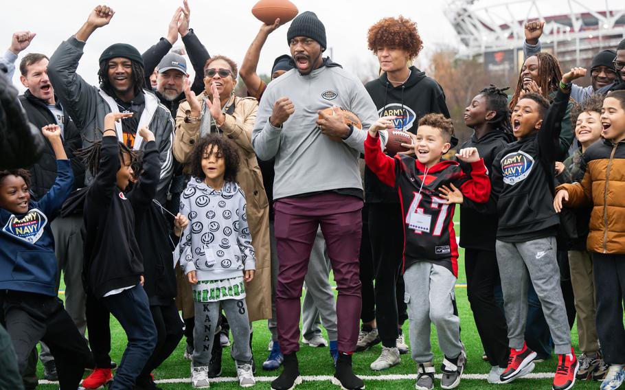 Robert Griffin III cheers with local military kids