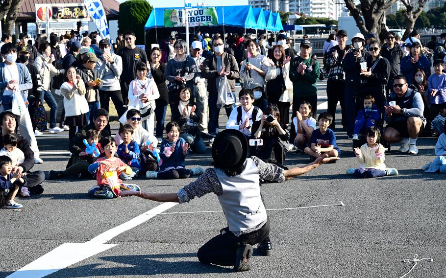 A streetperformer draws a crowd during the annual Spring Festival.