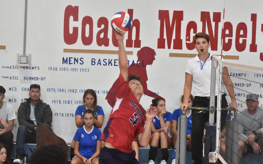 Aviano’s Cristiano Peterson connects during a spike against the Rota Admirals on Saturday, Oct. 14, 2023.